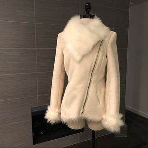 Asymmetrical, white, fur-lined jacket. Medium